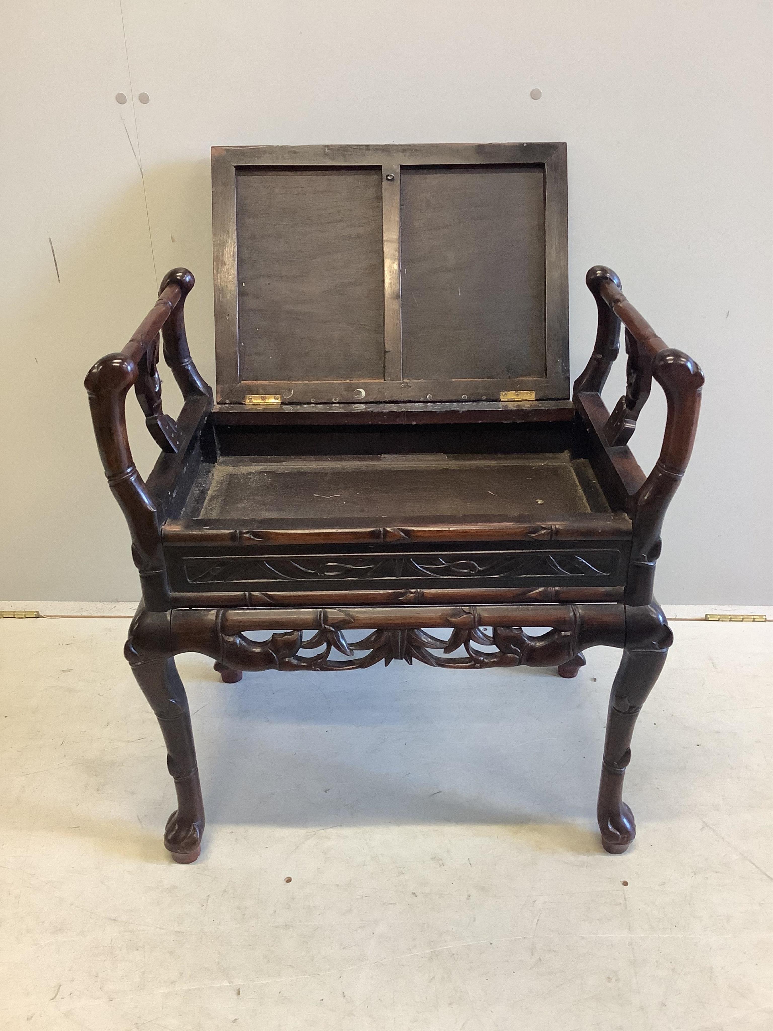 A Chinese hardwood piano stool, width 64cm, depth 43cm, height 70cm. Condition - good